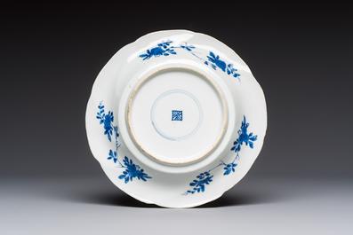 Four Chinese blue and white moulded plates with floral design, Kangxi