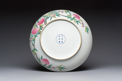 A Chinese famille rose 'Nine Peaches' dish on wooden stand, Yongzheng mark, 20th C.