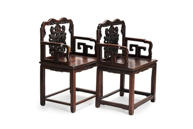 A pair of Chinese carved hongmu armchairs, 19th C.