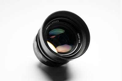 A Voigtl&auml;nder Nokton 50 mm F1.1 lens and hood