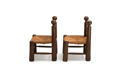 A pair of chairs in oak and straw, attributed to Charles Dudouyt, France, mid 20th C.
