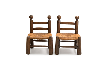 A pair of chairs in oak and straw, attributed to Charles Dudouyt, France, mid 20th C.