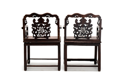 A pair of Chinese carved hongmu armchairs, 19th C.