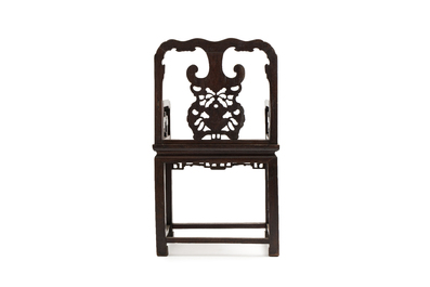 A Chinese carved hongmu armchair, 19th C.