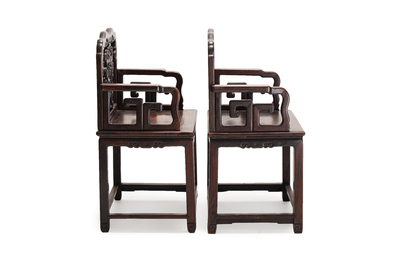 A pair of Chinese carved hongmu armchairs, 19th C.