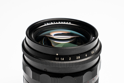 A Voigtl&auml;nder Nokton 50 mm F1.1 lens and hood