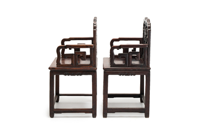 A pair of Chinese carved hongmu armchairs, 19th C.