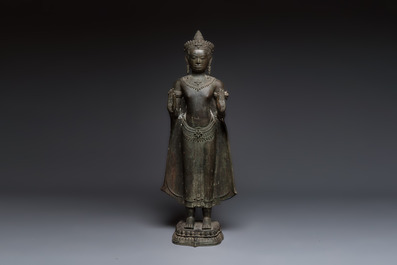A large bronze Lopburi-style standing Buddha Shakyamuni, Thailand or Cambodia, 20th C.