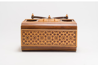 A Moorish-style wooden chest on stand with mirrors and geometric patterns, 20th C.