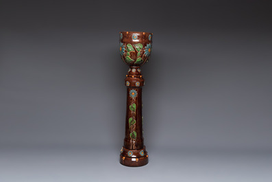 A very large Art Nouveau Flemish pottery four-piece jardini&egrave;re and stand, inscribed 'VREDE' and 'WELKOM', early 20th C.