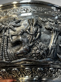 A large repouss&eacute; silver footed bowl depicting a hunting scene, India, late 19/early 20th C.