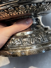 A large repouss&eacute; silver footed bowl depicting a hunting scene, India, late 19/early 20th C.