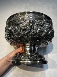 A large repouss&eacute; silver footed bowl depicting a hunting scene, India, late 19/early 20th C.