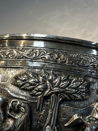 A large repouss&eacute; silver footed bowl depicting a hunting scene, India, late 19/early 20th C.