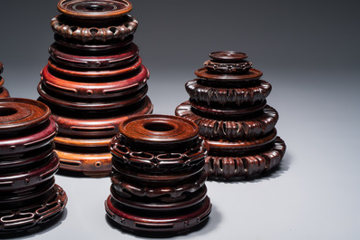A collection of 20 Chinese wooden stands, 19/20th C.