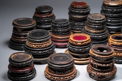 A collection of 80 Chinese wooden stands, 19/20th C.