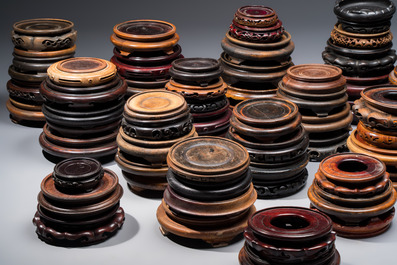 A collection of 75 Chinese wooden stands, 19/20th C.