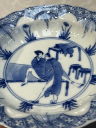 A Chinese blue and white 'Erotic Subject' saucer, Chenghua mark, Kangxi