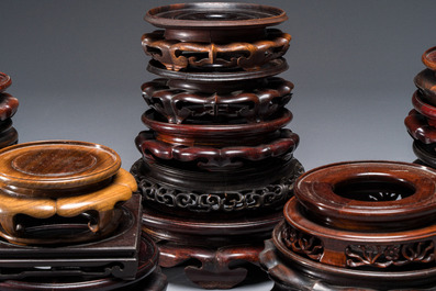 A collection of 20 Chinese wooden stands, 19/20th C.