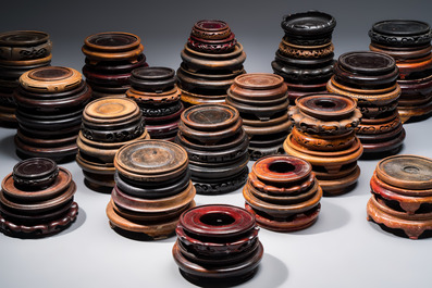 A collection of 75 Chinese wooden stands, 19/20th C.