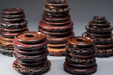 A collection of 20 Chinese wooden stands, 19/20th C.