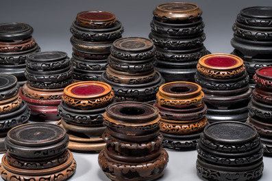 A collection of 80 Chinese wooden stands, 19/20th C.