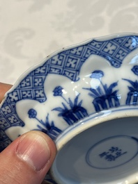 A Chinese blue and white 'Erotic Subject' saucer, Chenghua mark, Kangxi