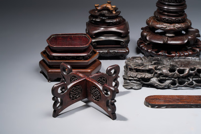 A collection of 25 Chinese wooden stands, 19/20th C.