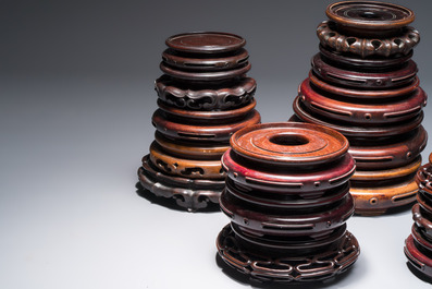 A collection of 20 Chinese wooden stands, 19/20th C.