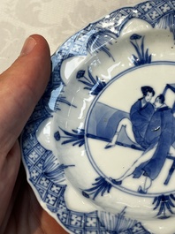 A Chinese blue and white 'Erotic Subject' saucer, Chenghua mark, Kangxi