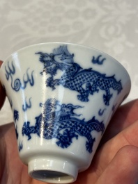 A pair of Chinese blue and white 'Bleu de Hue' 'Dragon' cups, Nhuoc Tham Tran Tang 若深珍藏 mark, 19th C.