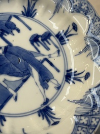 A Chinese blue and white 'Erotic Subject' saucer, Chenghua mark, Kangxi