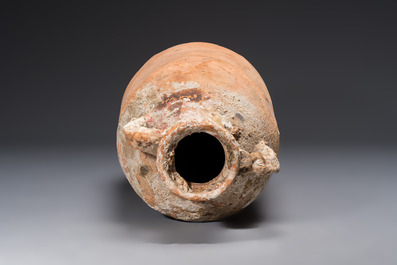 A large Roman pottery wine or fish oil transport amphora with marine encrustation, North Africa, 4/5th C.