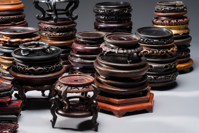 A collection of 70 Chinese wooden stands, 19/20th C.