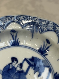 A Chinese blue and white 'Erotic Subject' saucer, Chenghua mark, Kangxi