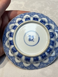 A Chinese blue and white 'Erotic Subject' saucer, Chenghua mark, Kangxi