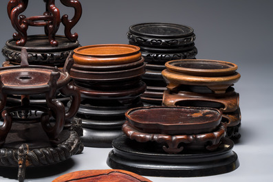 A collection of 40 mainly Chinese wooden stands, 19/20th C.