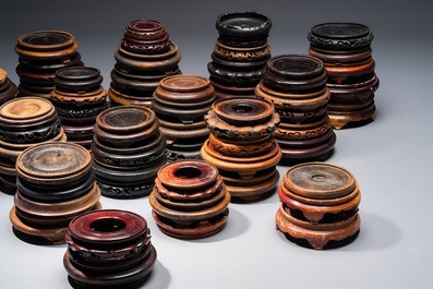 A collection of 75 Chinese wooden stands, 19/20th C.