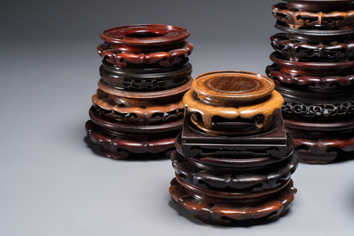 A collection of 20 Chinese wooden stands, 19/20th C.
