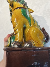 A pair of Chinese sancai-glazed Buddhist lions, Kangxi mark, 19th C.