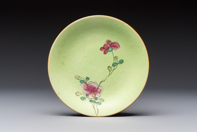 Four Chinese famille rose saucers and a gilt-decorated powder-blue-ground saucer, Qianlong and Jiaqing marks, 18/19th C.