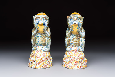 A pair of polychrome Dutch Delft monkey ewers and covers, 18th C.