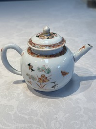 A Chinese famille verte teapot and three famille rose capucine-ground cups and saucers, Kangxi/Qianlong