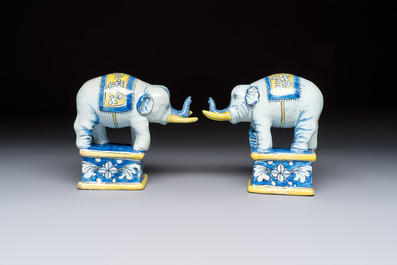 A pair of blue, white and yellow Frankfurt faience models of elephants, ca. 1700