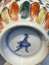 Seven Chinese famille verte cups and four saucers, conch shell and lingzhi marks, Kangxi