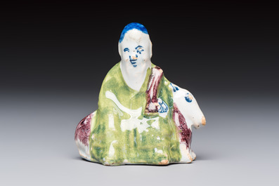 A polychrome Dutch Delft chinoiserie model of Shou Lao on a deer, 18th C.