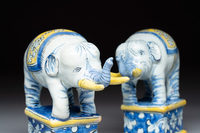 A pair of blue, white and yellow Frankfurt faience models of elephants, ca. 1700