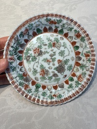 Seven Chinese famille verte cups and four saucers, conch shell and lingzhi marks, Kangxi
