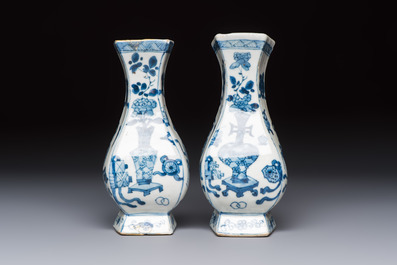 A pair of Chinese blue and white 'Antiquities' wall pocket vases, Kangxi