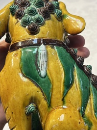 A pair of Chinese sancai-glazed Buddhist lions, Kangxi mark, 19th C.